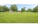 Large grassy backyard offers plenty of space, shed, and beautiful surrounding trees at 5709 Center Hill Church Rd, Loganville, GA 30052