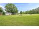 Huge backyard with a storage shed and room for outdoor activities at 5709 Center Hill Church Rd, Loganville, GA 30052
