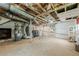 Unfinished basement with utility area and a white-painted brick wall at 5709 Center Hill Church Rd, Loganville, GA 30052