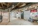 Unfinished basement with exposed ceiling, concrete floor, and a utility area at 5709 Center Hill Church Rd, Loganville, GA 30052