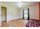 Bedroom featuring hardwood floors, a daybed, natural lighting, and a closet at 5709 Center Hill Church Rd, Loganville, GA 30052