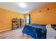 Bedroom featuring hardwood floors, a cozy bed, and a large storage cabinet at 5709 Center Hill Church Rd, Loganville, GA 30052