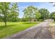 Charming home featuring a well-manicured lawn and long private driveway, offering a serene and inviting curb appeal at 5709 Center Hill Church Rd, Loganville, GA 30052