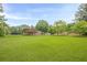 Home's well-manicured front lawn, mature trees create a picturesque setting at 5709 Center Hill Church Rd, Loganville, GA 30052