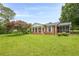 Charming home featuring a manicured front lawn and inviting front porch at 5709 Center Hill Church Rd, Loganville, GA 30052