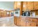 Galley style kitchen featuring lots of cabinet space and opening into living space at 5709 Center Hill Church Rd, Loganville, GA 30052
