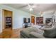 Spacious living room featuring a comfortable sectional couch, hardwood floors, and ample space for entertainment at 5709 Center Hill Church Rd, Loganville, GA 30052