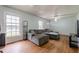 Bright living room with large windows, hardwood floors, and a spacious layout perfect for relaxation at 5709 Center Hill Church Rd, Loganville, GA 30052