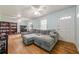 Inviting living room with hardwood floors, a large sectional couch, and plenty of natural light at 5709 Center Hill Church Rd, Loganville, GA 30052