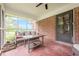Spacious screened porch with ample seating, offering a serene outdoor experience at 5709 Center Hill Church Rd, Loganville, GA 30052