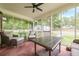 Relaxing screened porch with comfortable seating, perfect for enjoying the outdoors at 5709 Center Hill Church Rd, Loganville, GA 30052