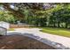 Spacious backyard featuring basketball court, storage shed, and lush greenery at 2010 2Nd Ave, Decatur, GA 30032