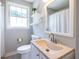 A well-lit bathroom features modern fixtures, a neutral color scheme and a shower with tub at 2010 2Nd Ave, Decatur, GA 30032