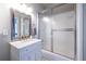 Bathroom featuring a vanity, a mirror, a shower-tub combo and tile flooring at 2010 2Nd Ave, Decatur, GA 30032