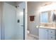 Modern bathroom featuring a glass-enclosed shower, white vanity, and updated fixtures at 2010 2Nd Ave, Decatur, GA 30032