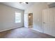 Bedroom features plush carpeting, a fan, natural light, and easy access to the bathroom at 2010 2Nd Ave, Decatur, GA 30032