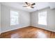 The bedroom features hardwood floors and lots of natural light streaming through two large windows at 2010 2Nd Ave, Decatur, GA 30032