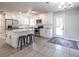 Modern kitchen featuring white cabinets, stainless steel appliances, granite countertops, and an island with seating at 2010 2Nd Ave, Decatur, GA 30032