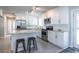 Bright kitchen with white cabinets, stainless steel appliances, granite countertops, and a center island with seating at 2010 2Nd Ave, Decatur, GA 30032