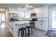Bright kitchen with white cabinets, stainless steel appliances, granite countertops, and a center island at 2010 2Nd Ave, Decatur, GA 30032