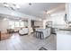 Open-concept kitchen flows into a living space featuring white cabinetry, granite countertops, and stainless steel appliances at 2010 2Nd Ave, Decatur, GA 30032