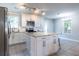 A well-lit kitchen features granite countertops, white cabinetry and stainless steel appliances at 2010 2Nd Ave, Decatur, GA 30032
