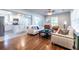 Open concept living area connecting to a modern kitchen with white cabinets, stainless steel appliances, and ample counter space at 2010 2Nd Ave, Decatur, GA 30032