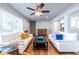 Cozy living room with hardwood floors, comfortable seating, and an open layout to the modern kitchen beyond at 2010 2Nd Ave, Decatur, GA 30032