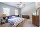 Light-filled primary bedroom with carpet, a ceiling fan, and large windows for a bright, airy feel at 2010 2Nd Ave, Decatur, GA 30032
