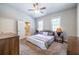 Main bedroom with carpet, a ceiling fan, furnishings and an ensuite bathroom at 2010 2Nd Ave, Decatur, GA 30032