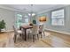 Cozy dining room featuring hardwood floors, chandelier, and lots of sunlight at 232 Oconee Way, Canton, GA 30114