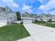 Street view of homes showing landscaped lawns, neutral siding, and neighborhood appeal at 232 Oconee Way, Canton, GA 30114