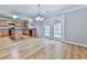 Open kitchen layout with wood cabinets, island, and easy access to the backyard at 232 Oconee Way, Canton, GA 30114