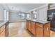 Spacious kitchen includes wooden cabinets, a center island, and stainless steel fridge at 232 Oconee Way, Canton, GA 30114