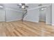 Open-concept living room with hardwood floors, stairs, and neutral walls at 232 Oconee Way, Canton, GA 30114