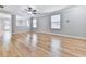 Bright open-concept living room features beautiful hardwood floors and neutral walls at 232 Oconee Way, Canton, GA 30114