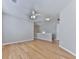 Second story loft space with wood floors, neutral walls, and ceiling fan at 232 Oconee Way, Canton, GA 30114