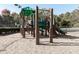 This community playground has climbing structure, slide, and wood chip ground cover at 232 Oconee Way, Canton, GA 30114