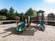 This community playground features slides, climbing structures, and is on a wood chip surface at 232 Oconee Way, Canton, GA 30114