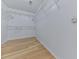This walk-in closet features wooden floors and built-in shelving, providing ample storage space at 232 Oconee Way, Canton, GA 30114