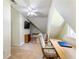Attic room featuring carpet, 2 desks, multiple chairs, and a ceiling fan at 5020 Bayberry Dr, Cumming, GA 30040