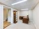 This basement offers a shelf, desk, stairs and comfortable carpeting at 5020 Bayberry Dr, Cumming, GA 30040