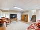 Finished basement offers cozy seating, carpet, and a staircase leading upstairs at 5020 Bayberry Dr, Cumming, GA 30040