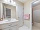 Bathroom with a vanity sink, mirror, a door, and an open view to a shower and tub at 5020 Bayberry Dr, Cumming, GA 30040