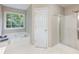 Bathroom featuring a shower, soaking tub and a large window that offers bright natural light at 5020 Bayberry Dr, Cumming, GA 30040