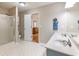 Bathroom features a dual sink vanity, a walk-in shower, and a doorway to the bedroom at 5020 Bayberry Dr, Cumming, GA 30040