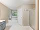 Bathroom featuring a shower, soaking tub and a large window that offers bright natural light at 5020 Bayberry Dr, Cumming, GA 30040
