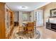 Bright breakfast nook features wood table, built-in cabinet, and doorway to the home's exterior at 5020 Bayberry Dr, Cumming, GA 30040