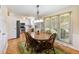Open dining area off the kitchen boasts a large table, natural light, and modern fixtures at 5020 Bayberry Dr, Cumming, GA 30040
