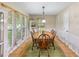 Dining room featuring a traditional table set, ample natural light, and a bright rug at 5020 Bayberry Dr, Cumming, GA 30040